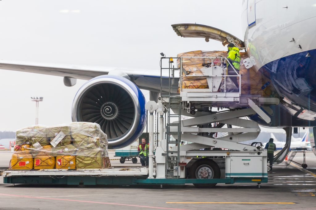 Loading cargo into the aircraft before departure in Domodedovo airport ...